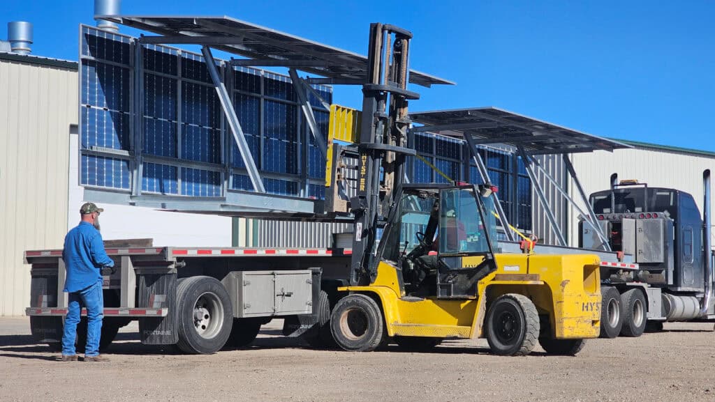 solar power system being loaded on a trailer